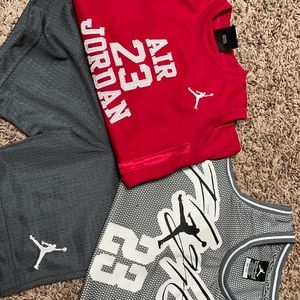 2 Boys size 6 Jordan Jerseys + pair of 6 shorts.